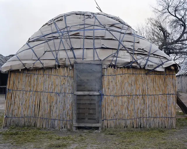 A Kickapoo dwelling made out of straw and corrugated cardboard, Eagle Pass, Texas, January by Joel Sternfeld