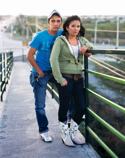 Couple outside the Sun Mall in Juarez Suburb by Alejandro Cartagena