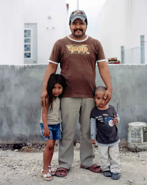 Father with children after gathering wood in Juarez Suburb by Alejandro Cartagena